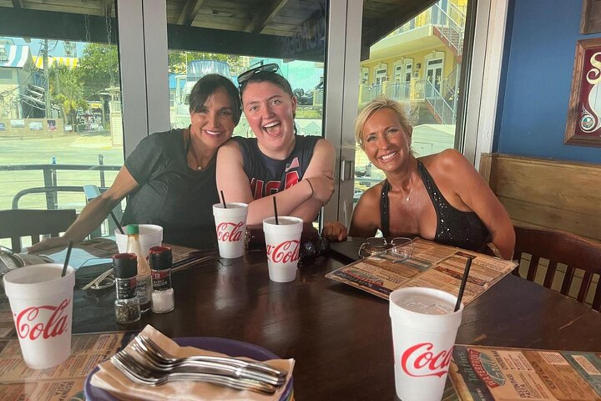 a group of three people sitting at a table