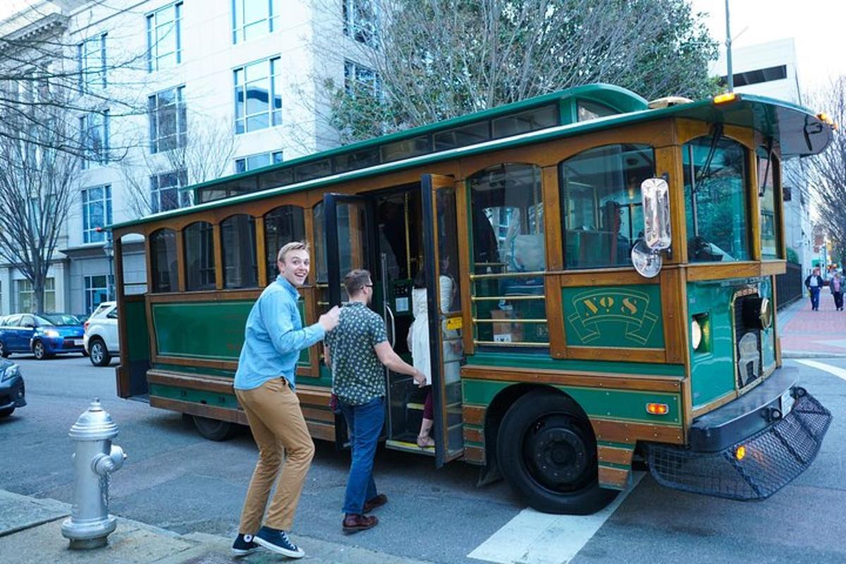 two people are standing in a green bus
