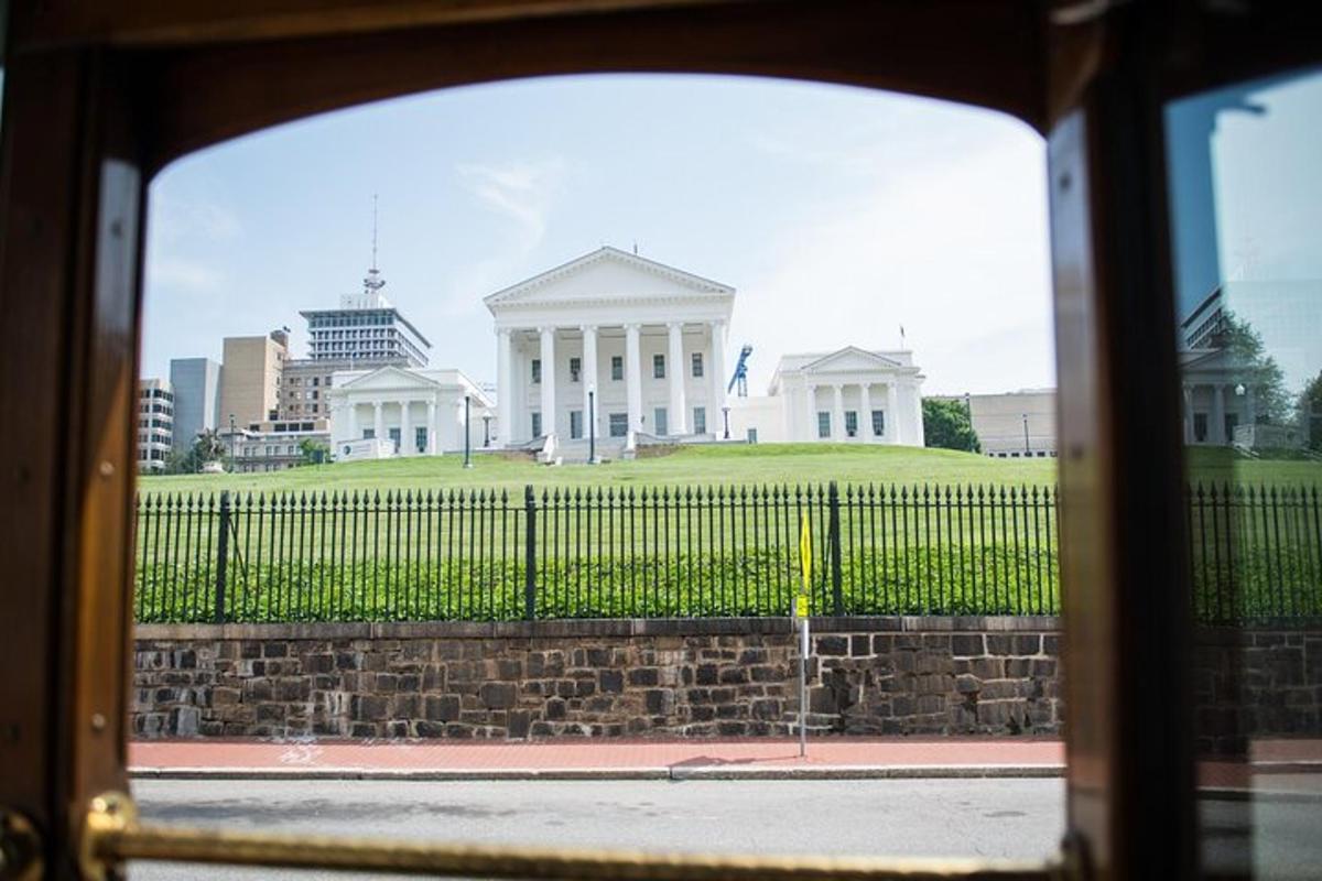 a view of a white house with a fence