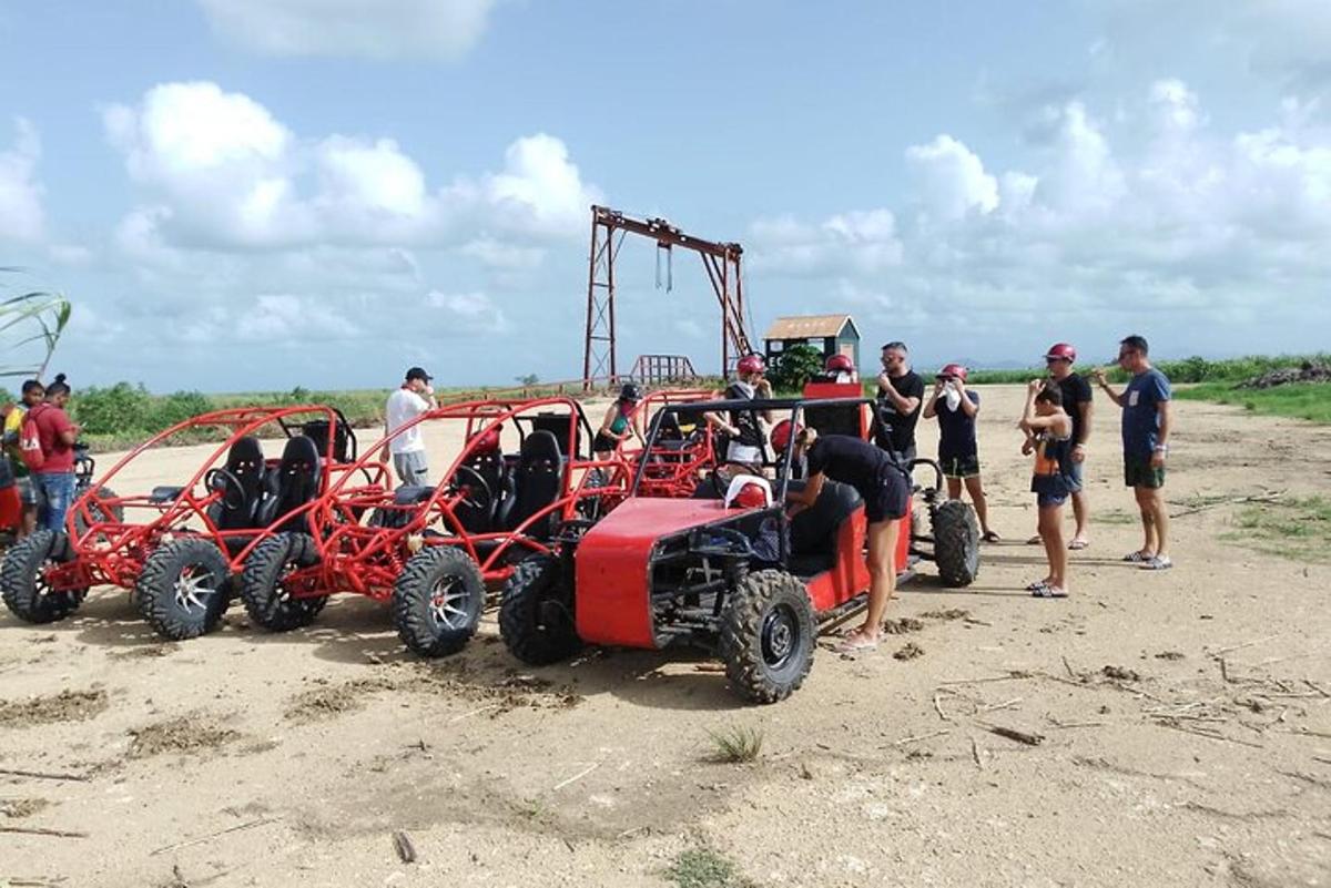a group of people standing around a four wheeled vehicle