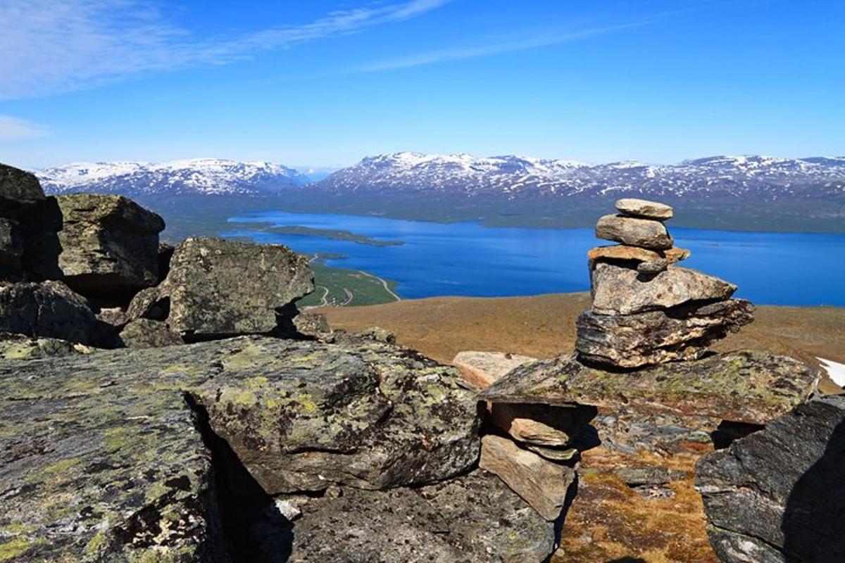 a stack of rocks on top of a mountain