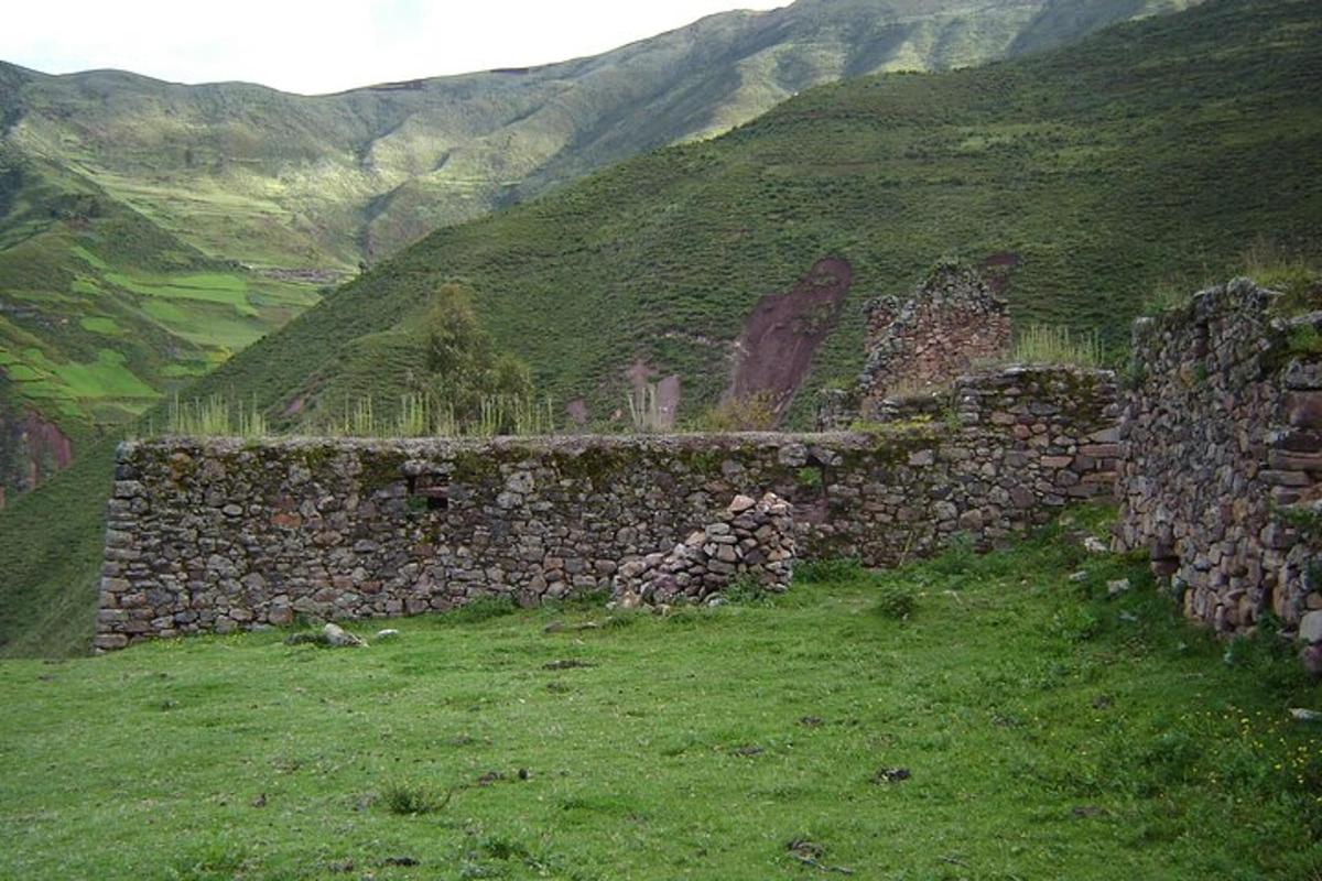 a stone wall on the side of a mountain