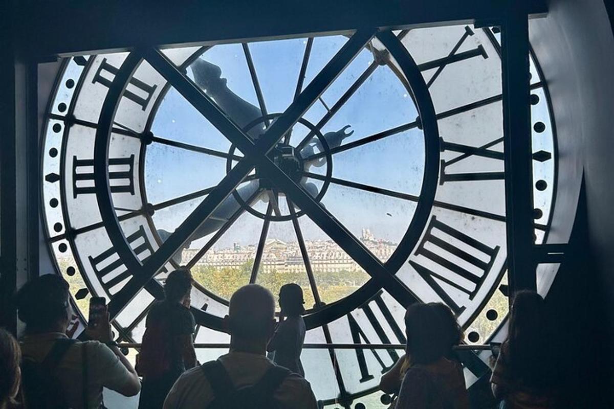 a group of people standing in front of a large clock