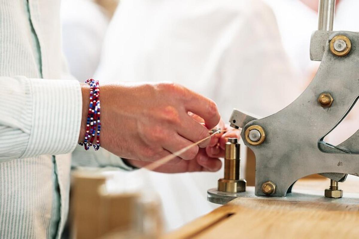 a man is working on a sewing machine