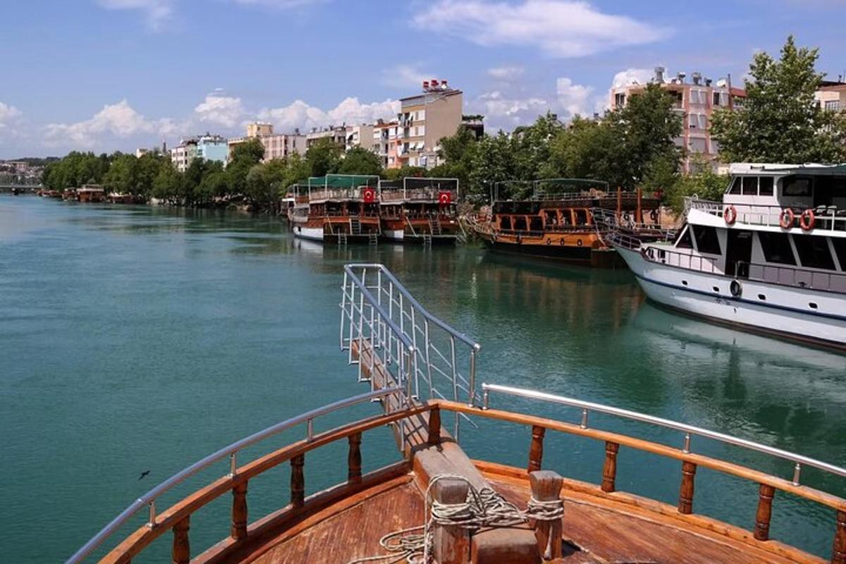 a boat is docked in a river with buildings