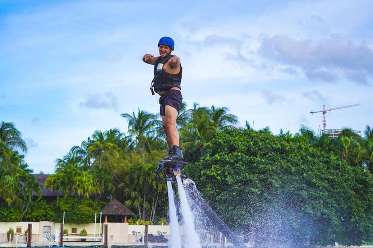 a man standing on top of a water fountain