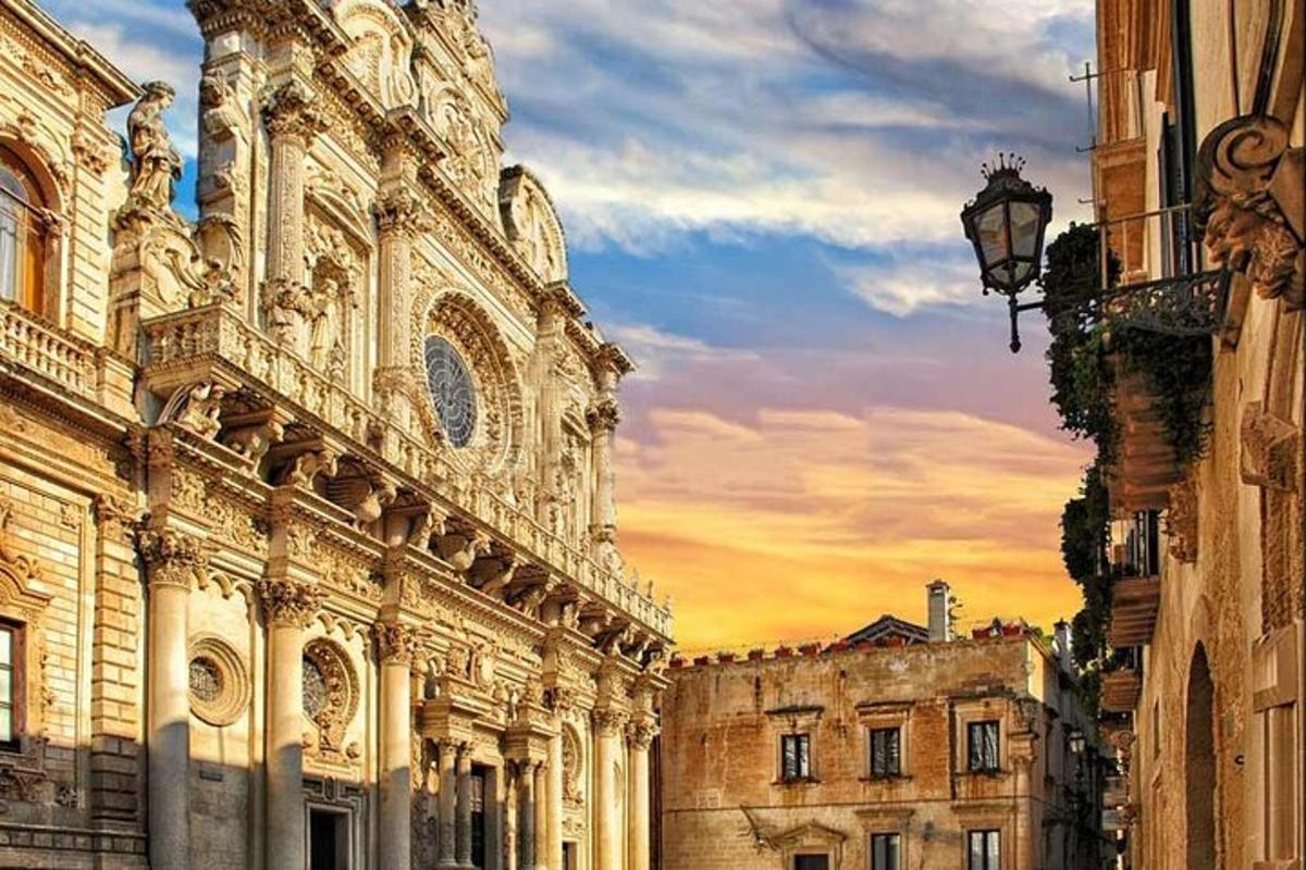 a large building with a sunset in the background