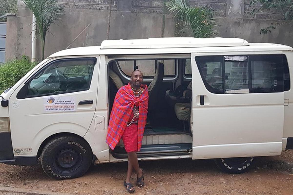 a man standing next to a white van