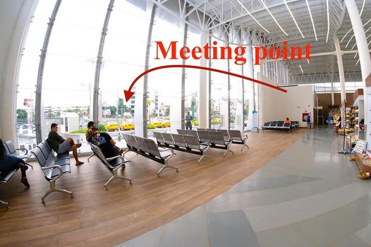 a meeting point in a building with people sitting in chairs
