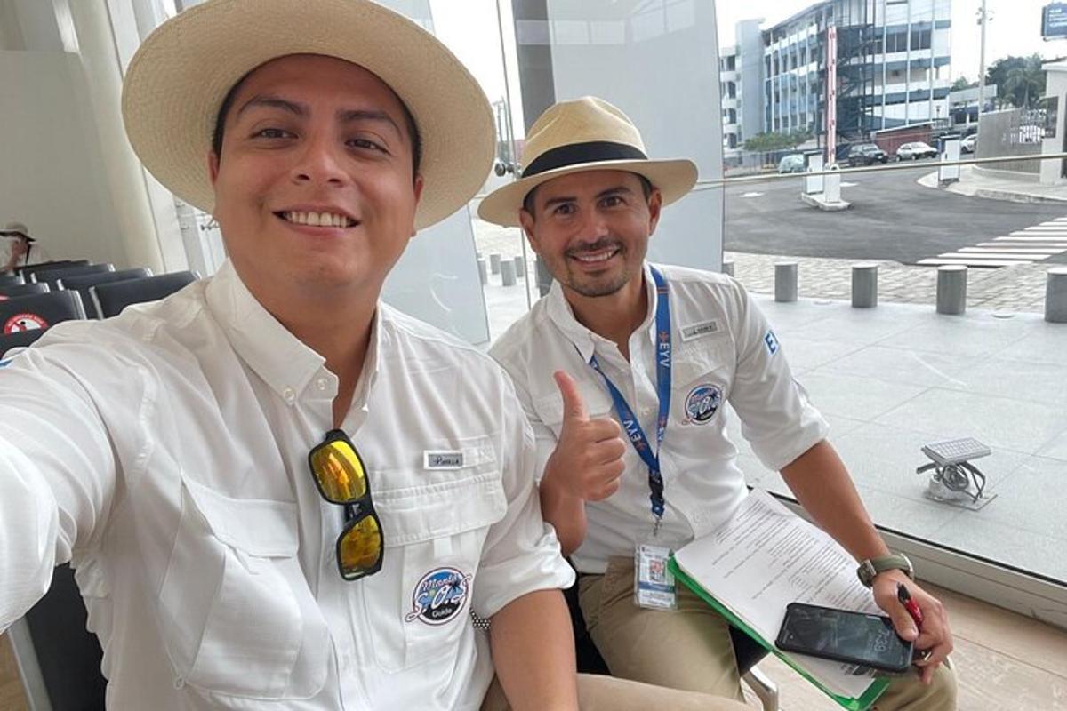 two men wearing hats sitting next to each other