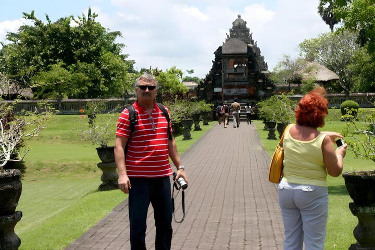 a man and a woman walking down a sidewalk