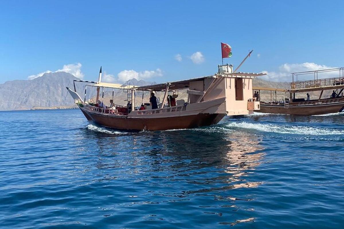 a boat with people on it in the water