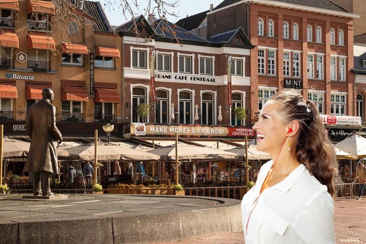 a woman standing in front of a fountain in a city