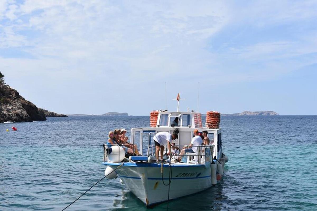 a group of people on a boat in the water