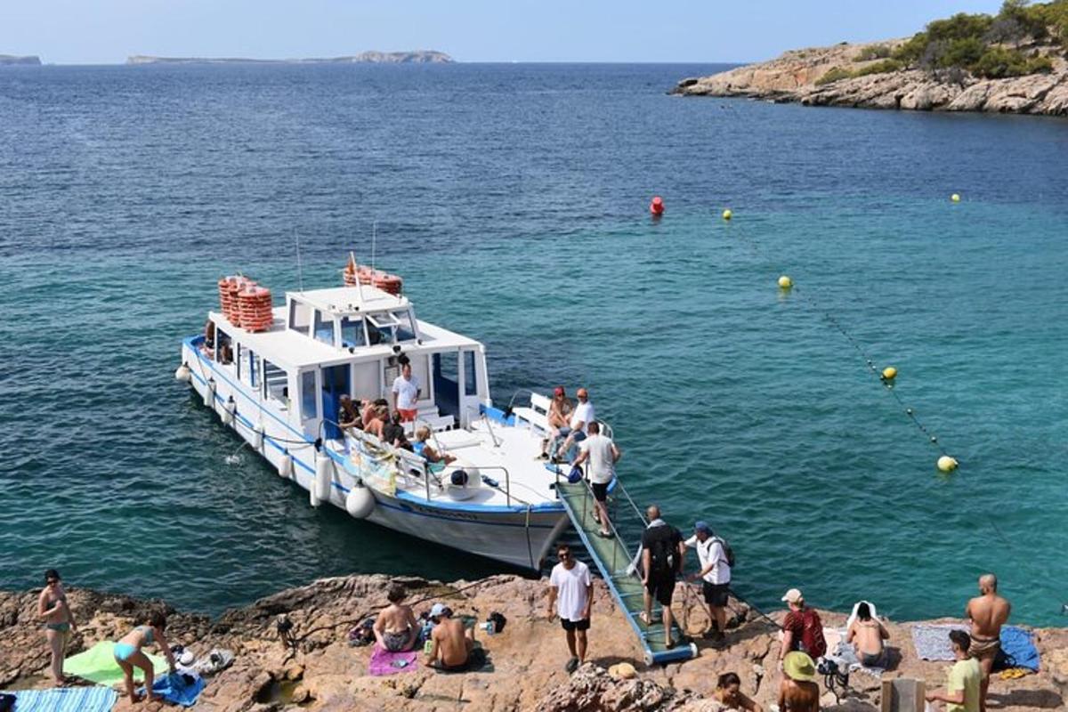 a group of people on a boat in the water