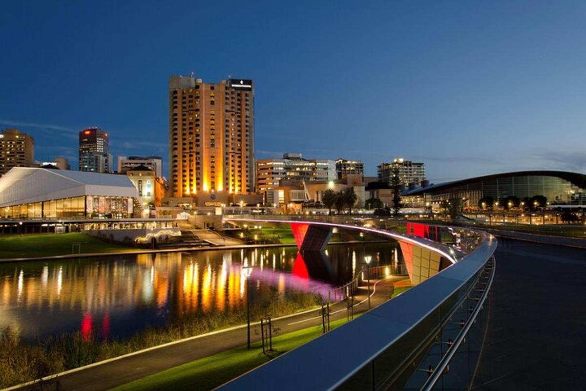 a bridge over a river in a city at night