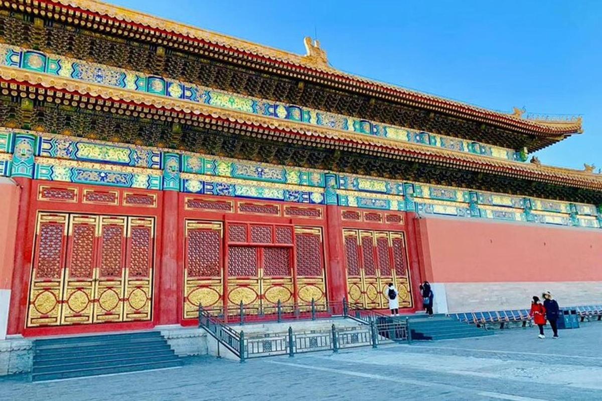 a large building with people standing in front of it