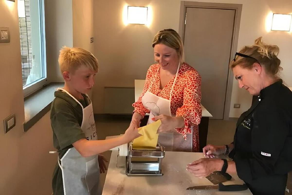 a woman and a boy are standing at a counter