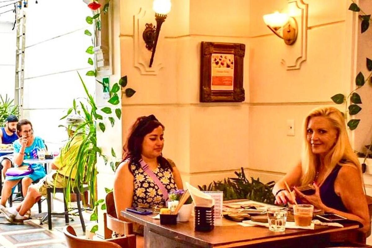 two women sitting at a table in a restaurant