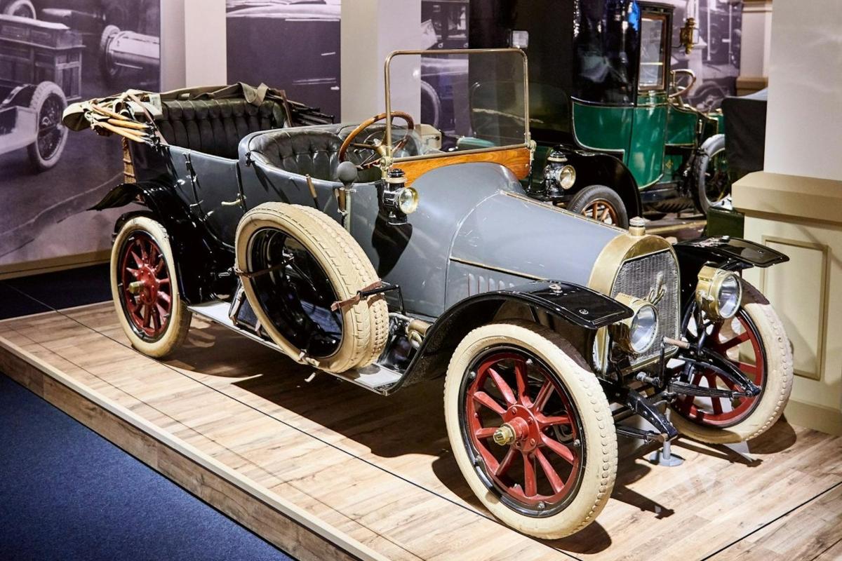 an old car on display at a museum