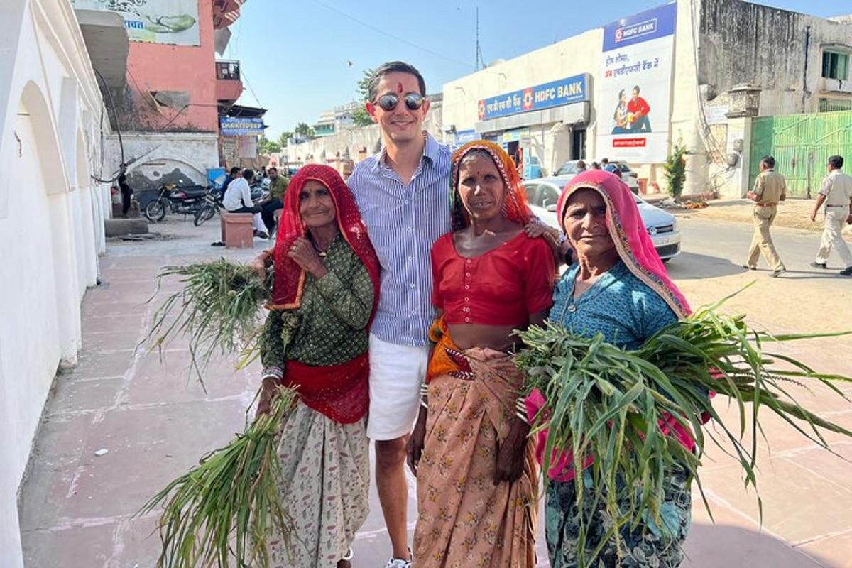a man and three women standing on a street