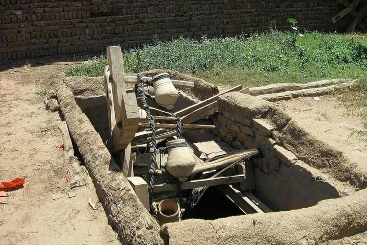 a concrete mixer in a hole in the ground