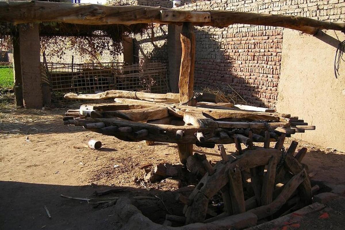 a pile of logs sitting next to a building