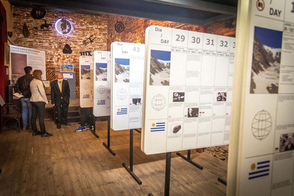 a group of people standing in a room with posters