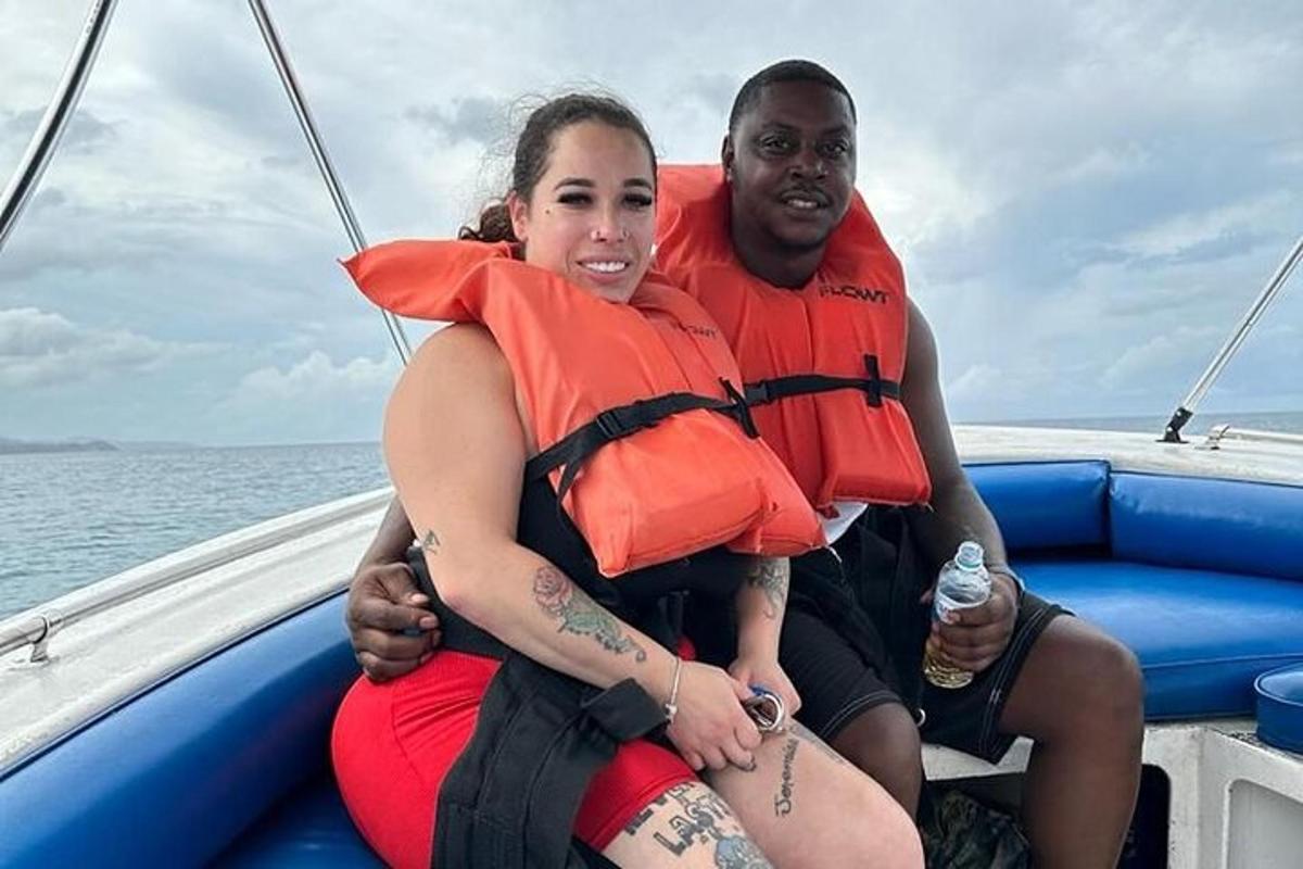 a man and a woman sitting on a boat