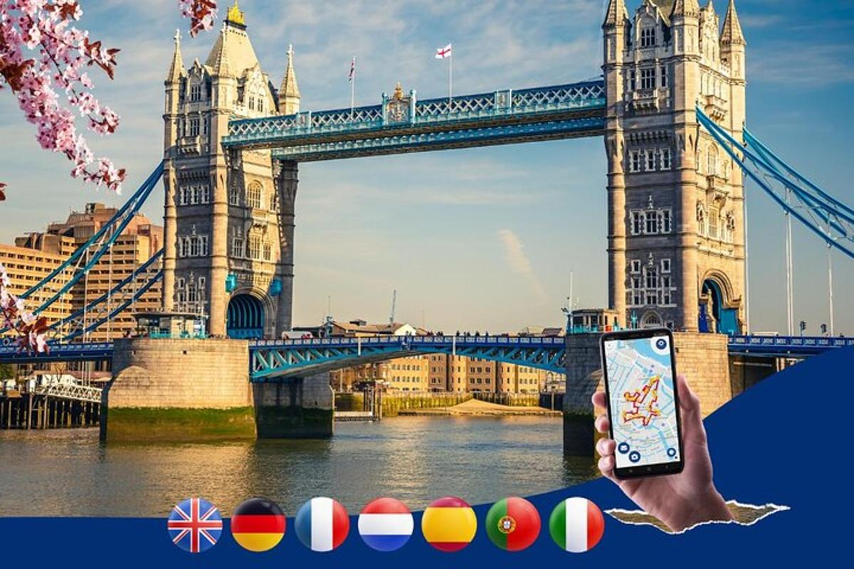 ruka držící mobilní telefon před mostem