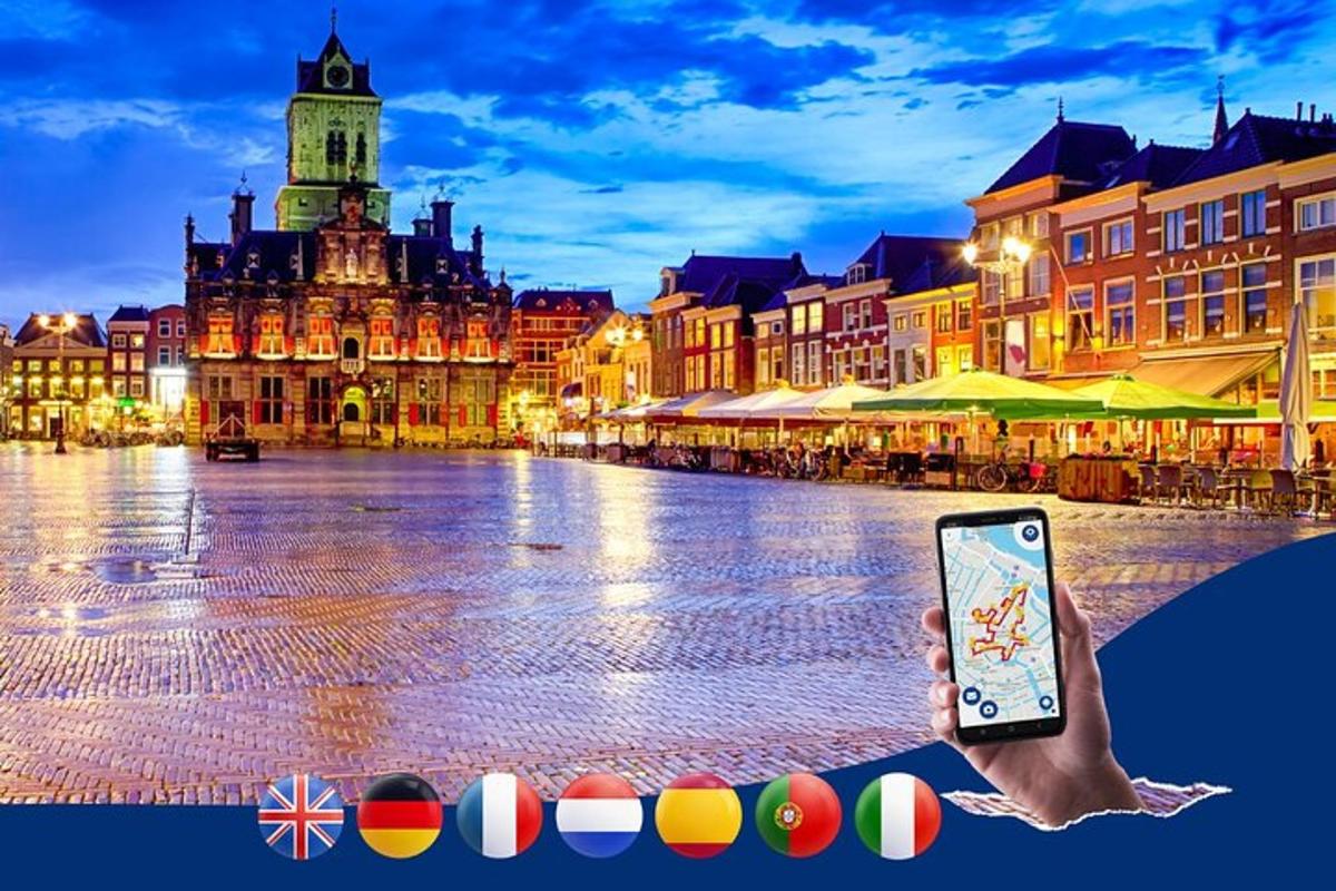 una persona che tiene in mano un telefono cellulare in una strada cittadina
