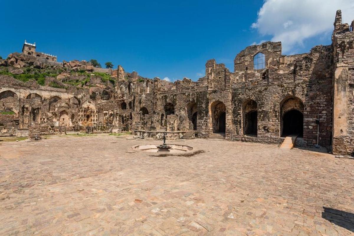 an old stone building with a stone courtyard