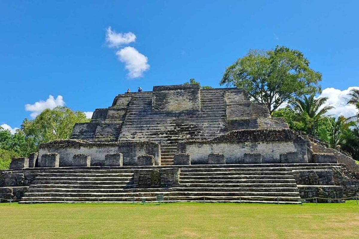 a pyramid at an temple with people on top