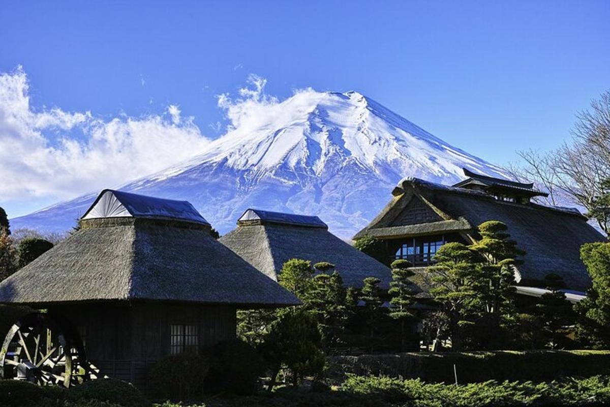 a mountain in the background with roofs of houses
