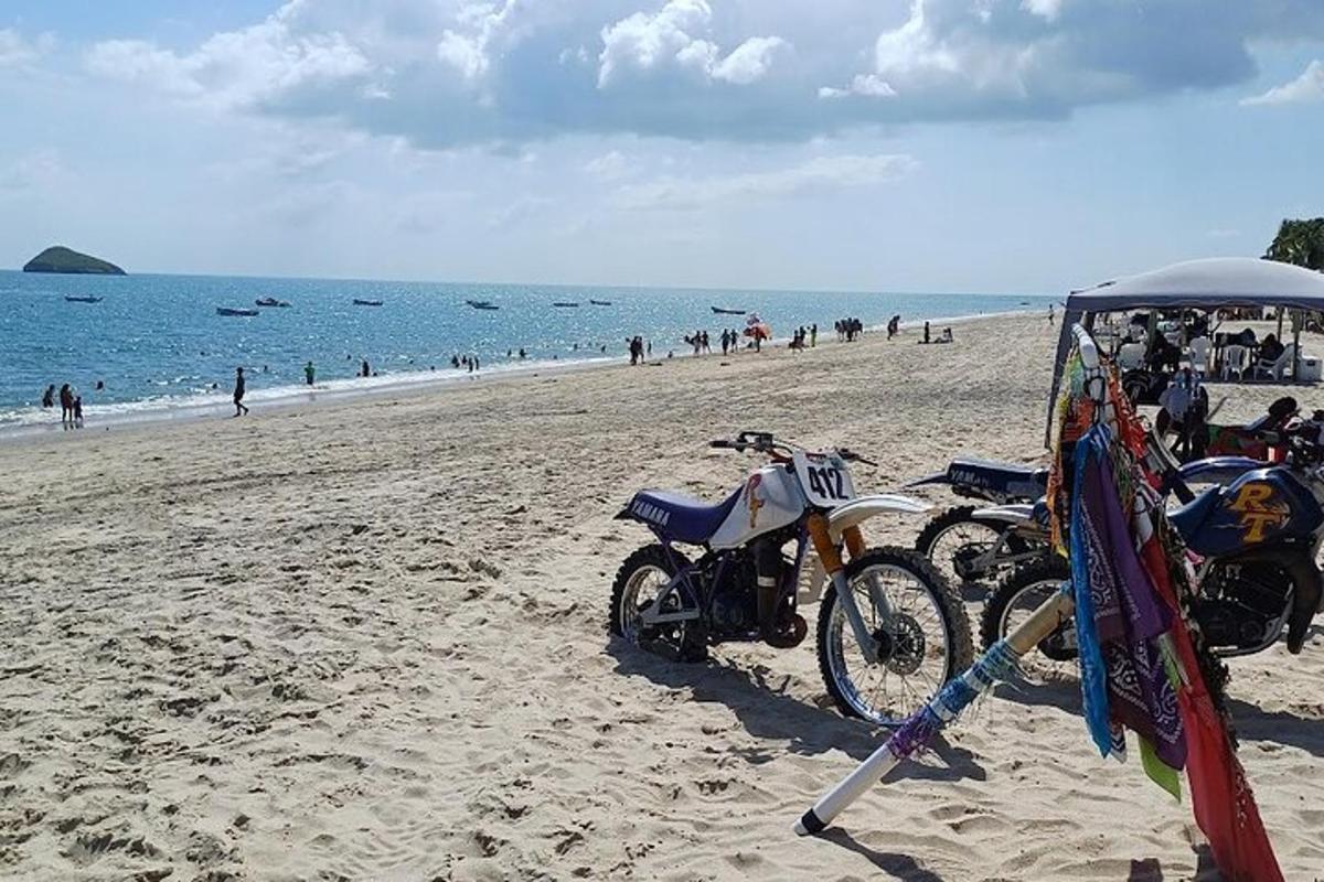 a couple of motorcycles parked on a beach