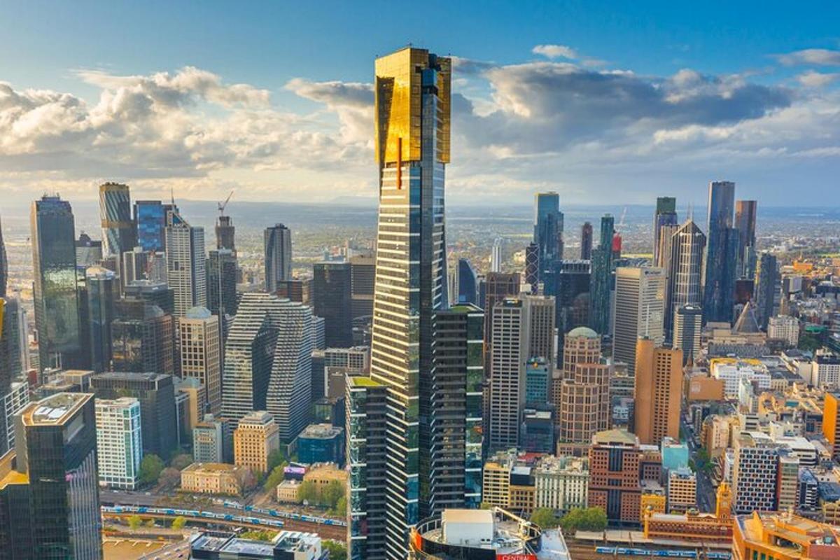 a view of a large city with a tall skyscraper