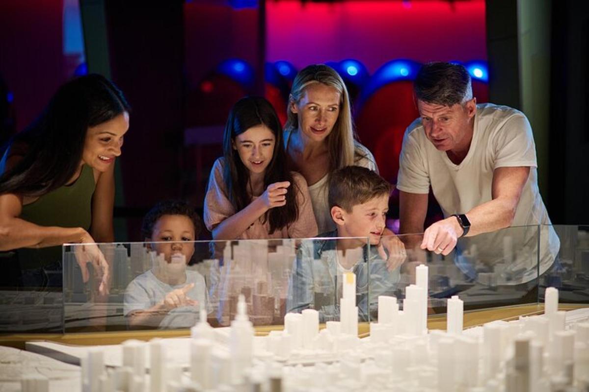 a group of people standing around a glass table