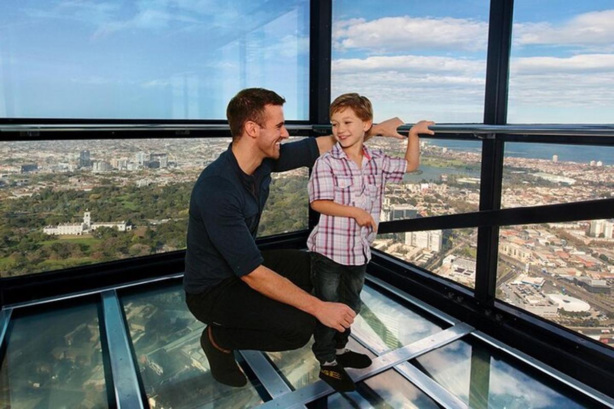 two men standing on the glass floor of a building