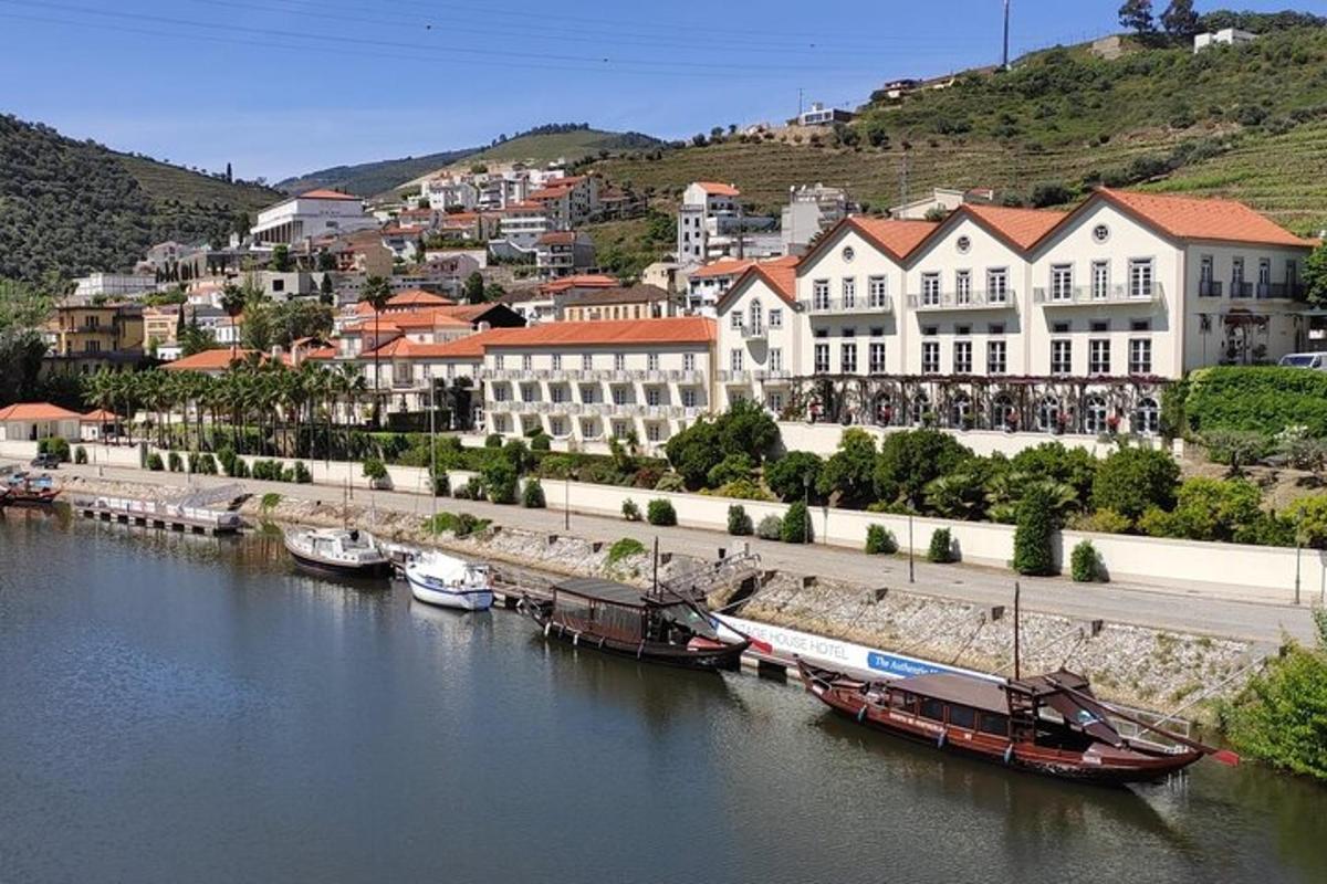 a city with boats docked in a river with buildings