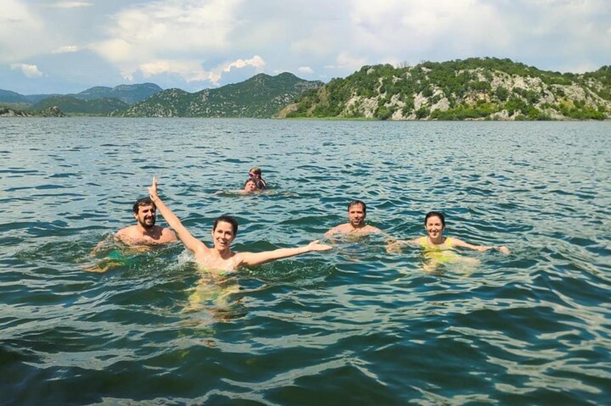 a group of men swimming in the water