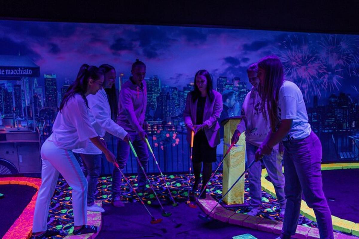 a group of people standing in front of a stage