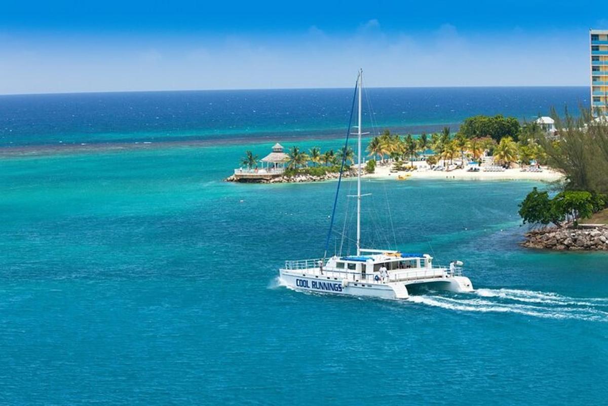 a boat in the water next to an island