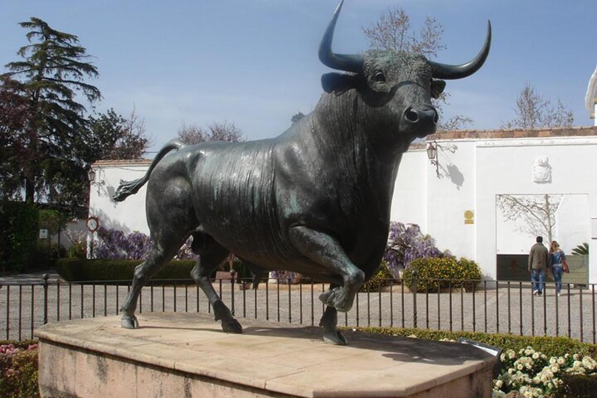 a statue of a bull on a pedestal