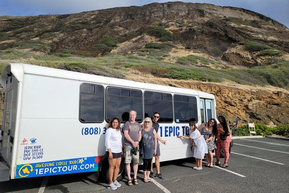 a group of people standing in front of a bus