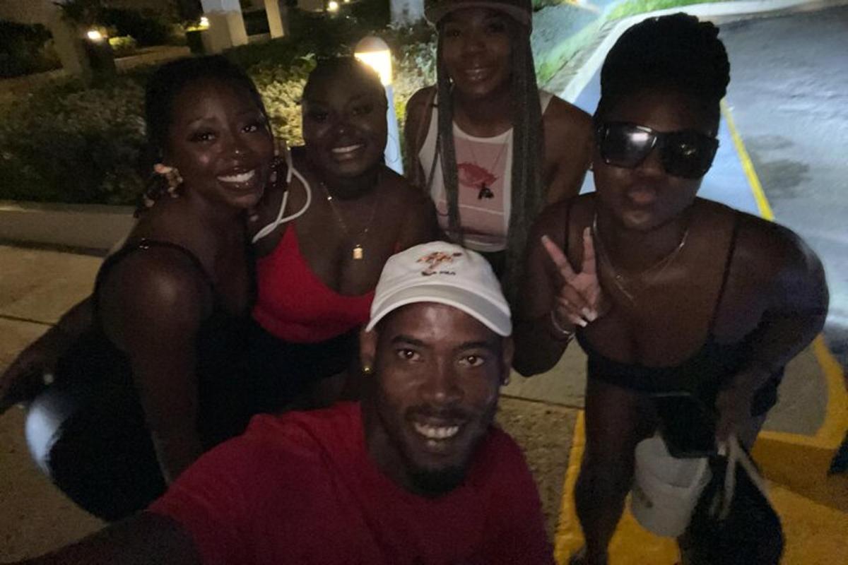 a group of people posing for a picture at a pool