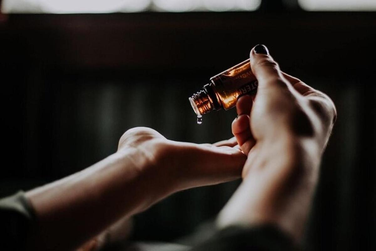a person holding a bottle in their hands