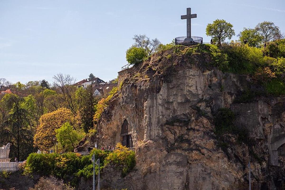 a cross on top of a rocky mountain