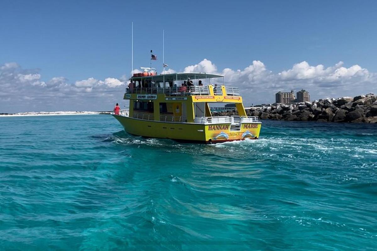 a yellow boat in the water in the ocean