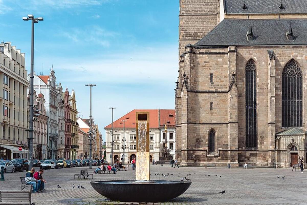 a church with a fountain in the middle of a street