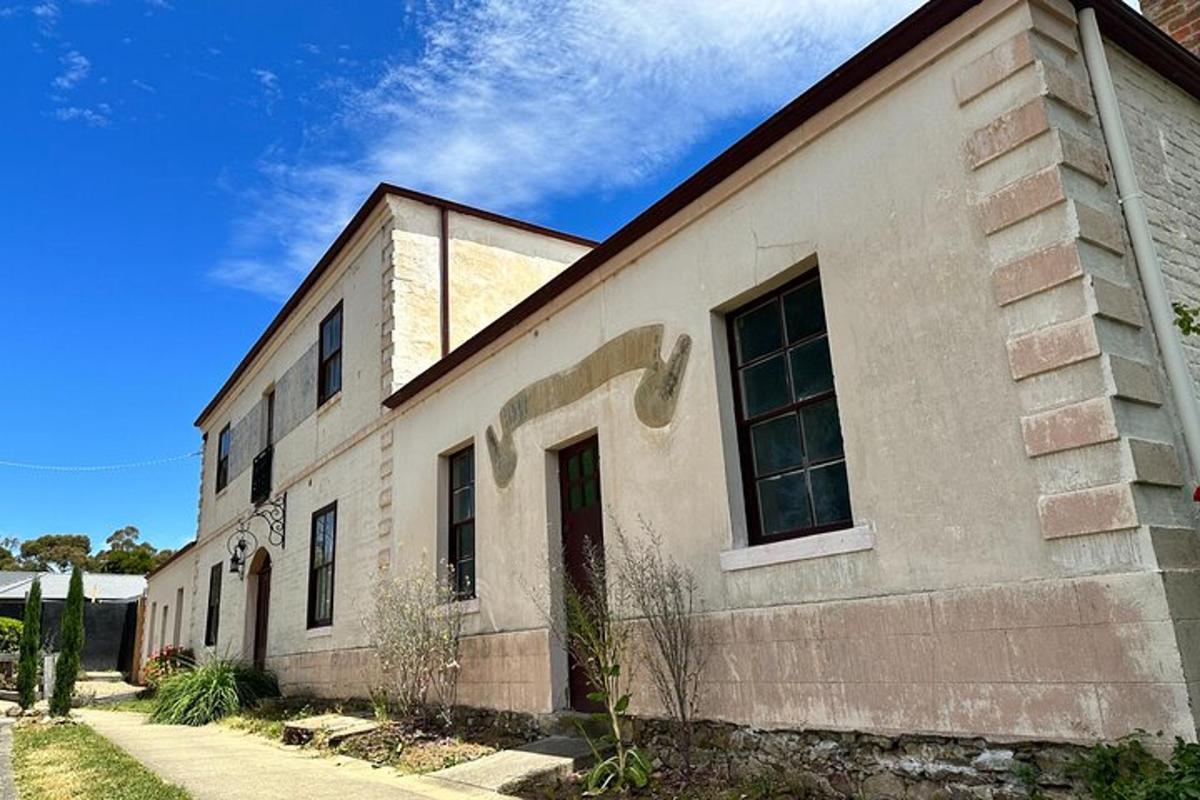 an old brick building with a blue sky in the background